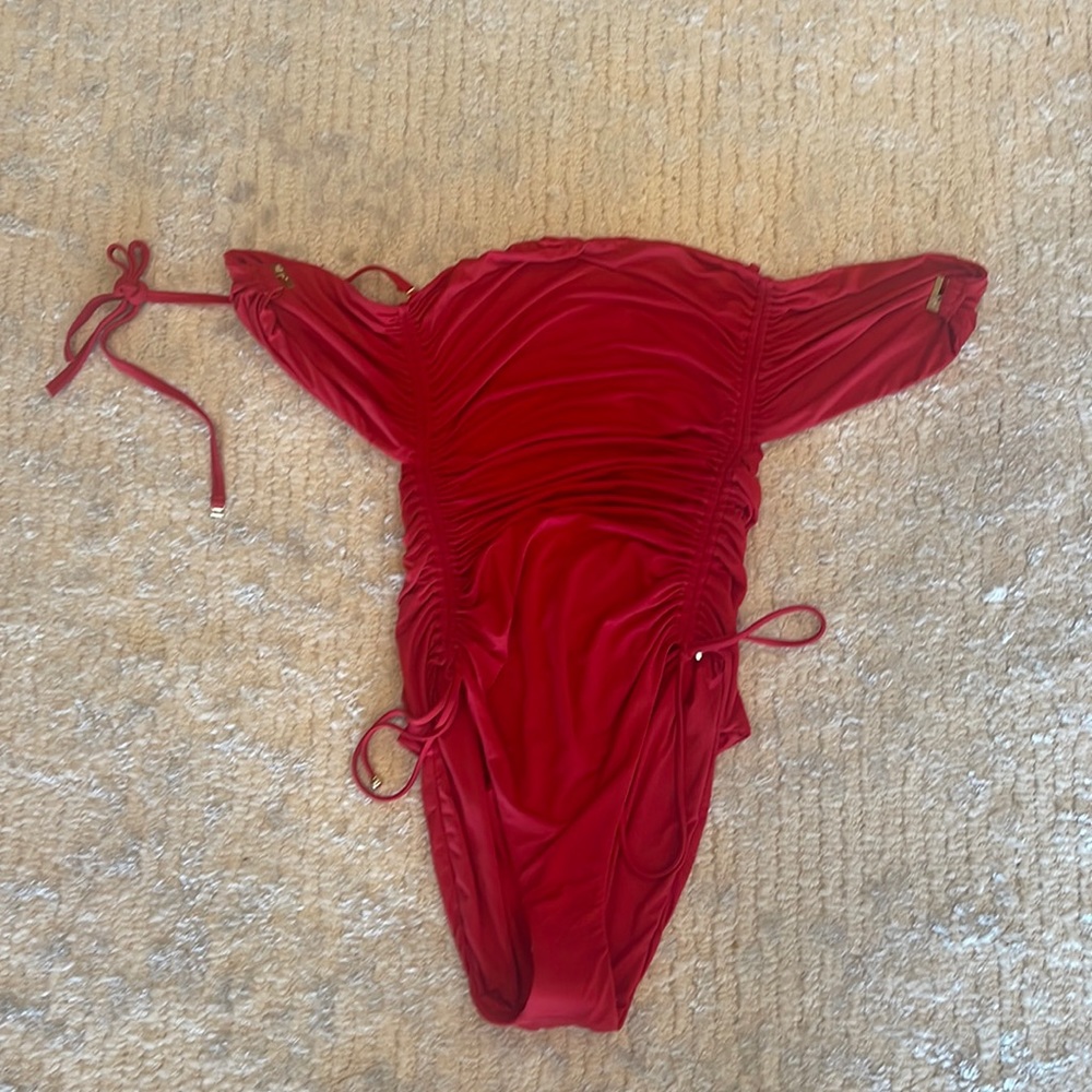 One piece bathing suit. Can be worn strapless also